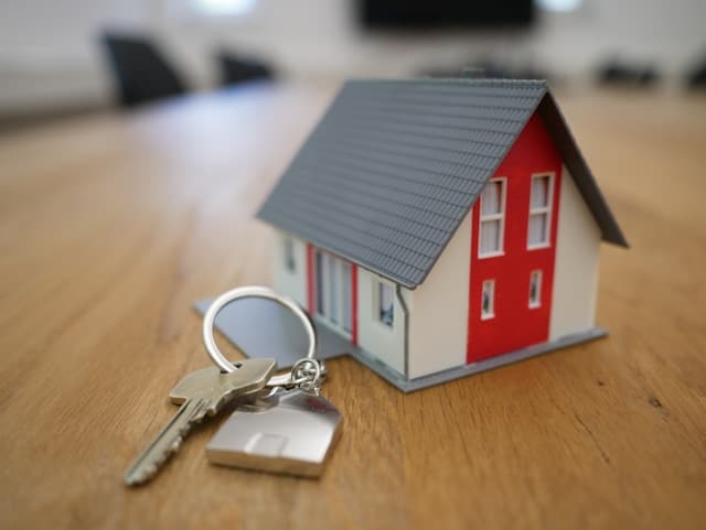 a model house beside keys