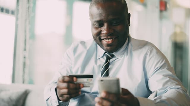 person making payment on their phone