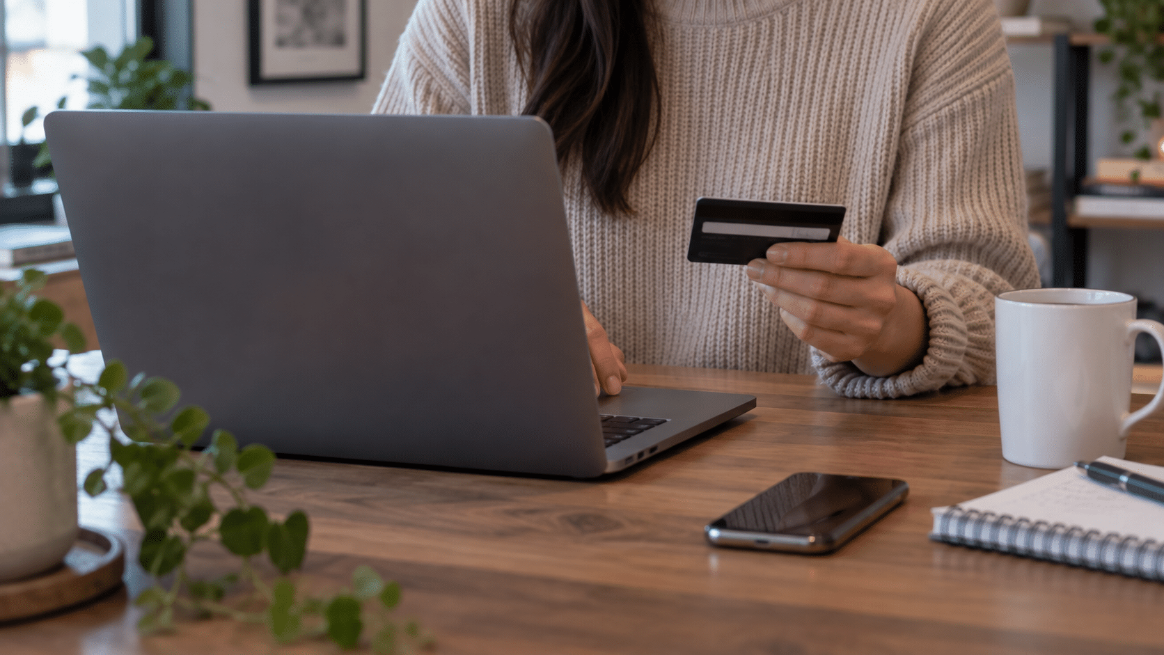 A person making an online payment through their laptop