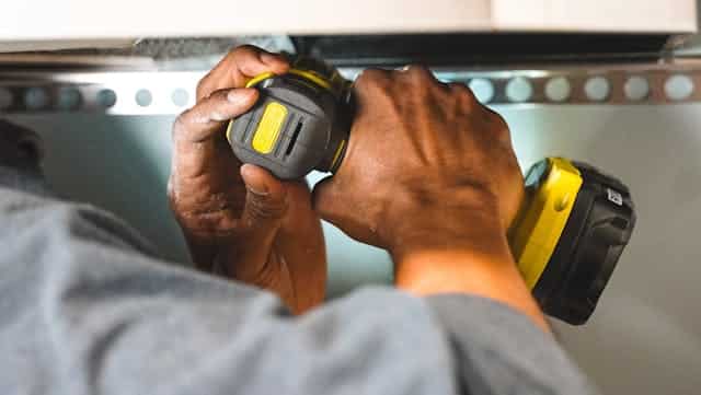 a person doing home repairs